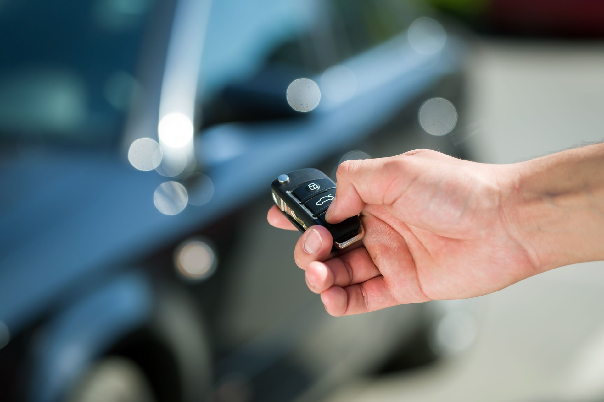 man hand unlocking car